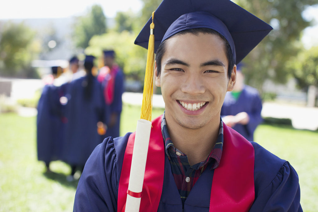 Graduate smiling outdoors